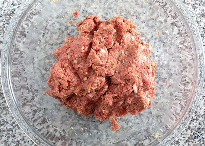 Meatloaf ingredients mixed together in a mixing bowl for the best meatloaf recipe