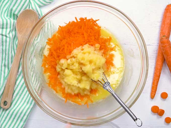 Bowl with grated carrots and crushed pineapple for homemade carrot cake