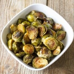 Maple Roast Brussels Sprouts in a white serving bowl