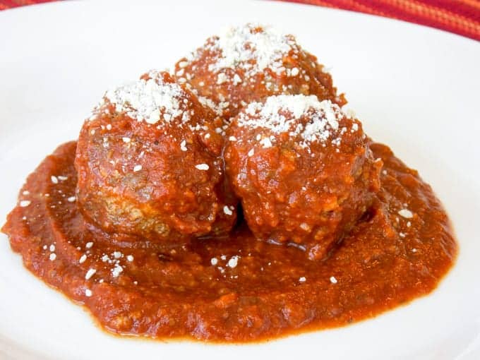 3 Crock Pot Meat Balls with sauce in a white bowl