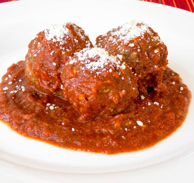 3 Crock Pot Meat Balls with sauce in a white bowl