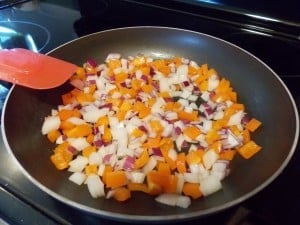 peppers and onions in a skillet