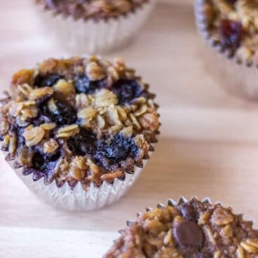 oatmeal muffins with different toppings on a cutting board