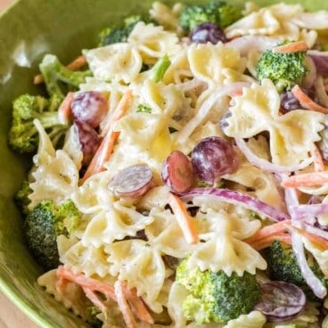 broccoli grape pasta salad in a green bowl