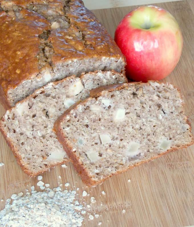 sliced Apple Cinnamon Oatmeal Bread on a cutting board