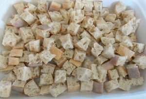 cubed bread in a baking dish