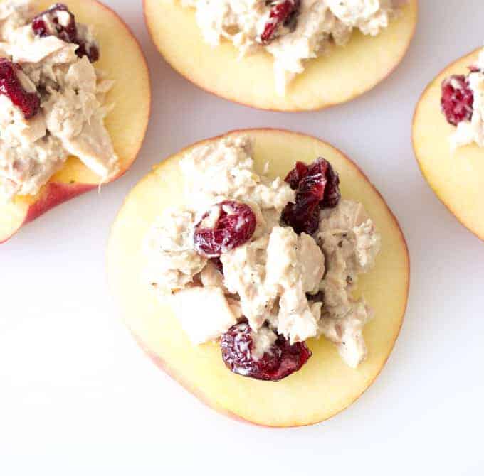 Cranberry Tuna Salad on Apple Slices on a white board