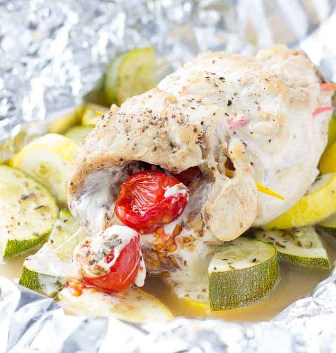 Caprese Stuffed Chicken and sliced squash on foil