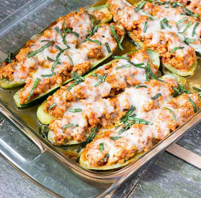 baking dish full of Chicken Parmesan Zucchini Boats