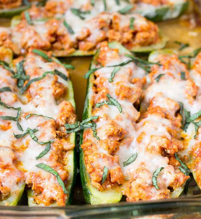 baking dish full of Chicken Parmesan Zucchini Boats