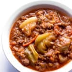bowl of soup with ground beef, cabbage, vegetables, and rice