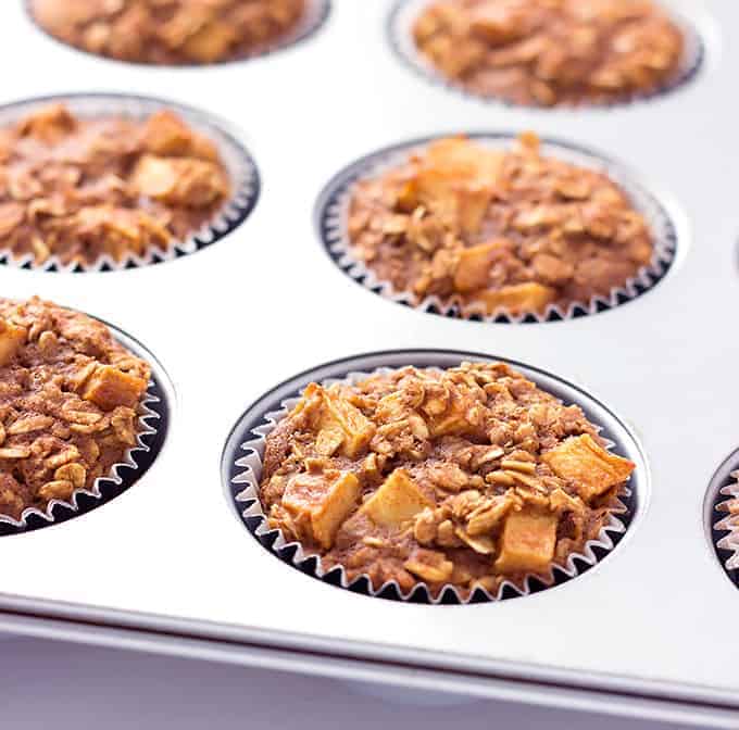 muffin tin full of Apple Cinnamon Baked Oatmeal Muffins