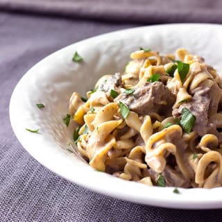 bowl full of slow cooker beef stroganoff with egg noodles