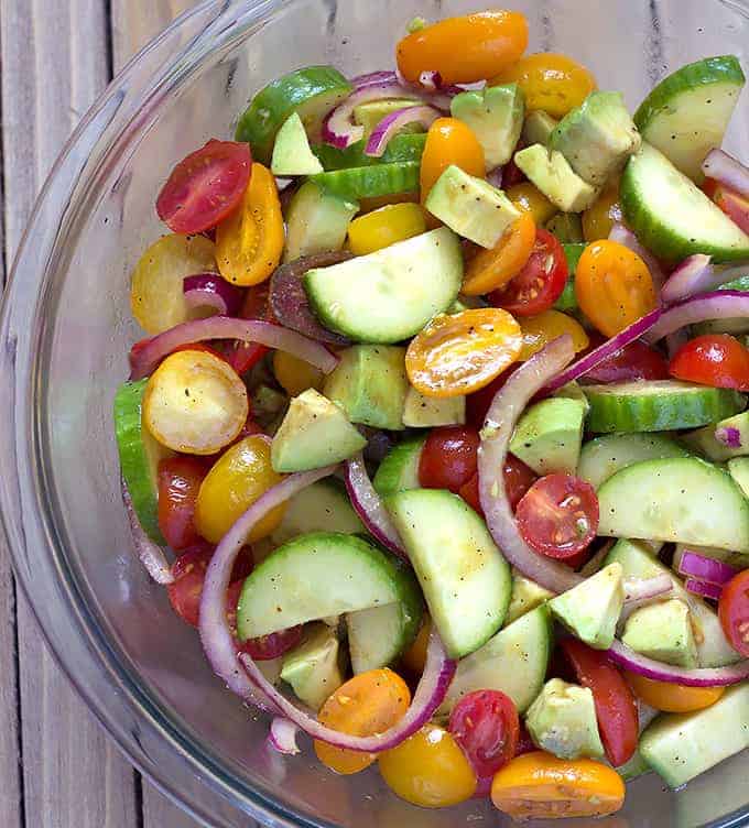 glass bowl full of Avocado Cucumber Tomato Salad with Balsamic Vinaigrette