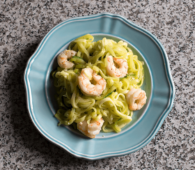 overhead shot of Lemon Garlic Shrimp & Zucchini Noodles on a blue plate