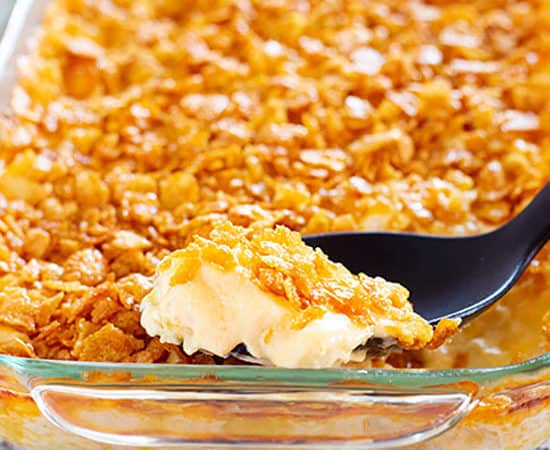 cheesy potato casserole with corn flake topping