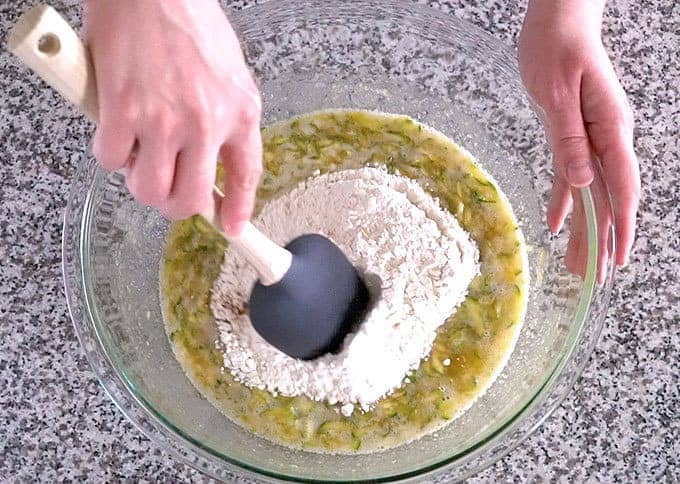 The dry ingredients on top of the wet ingredients for the best zucchini bread recipe