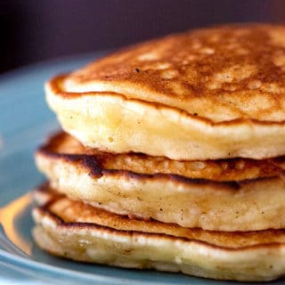Close up of the soft fluffy insides of three stacked pancakes