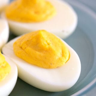 Deviled eggs on a blue plate from the best deviled egg recipe