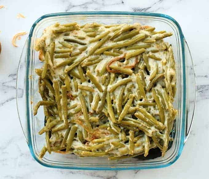 Ingredients for green bean casserole in a baking dish