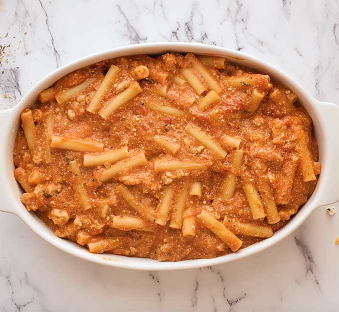 Baking dish of ziti in meat sauce