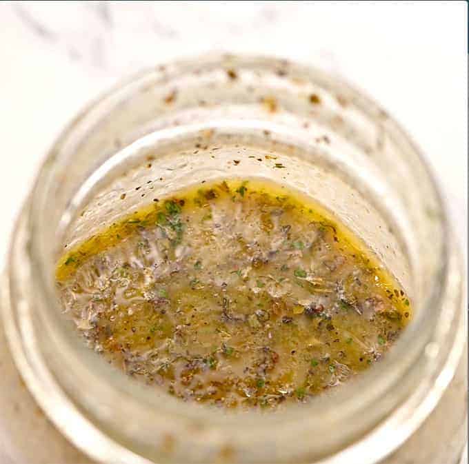 mason jar full of oil and vinegar salad dressing