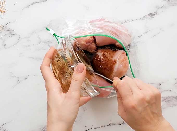 chicken thighs and teriyaki marinade in a plastic food storage bag