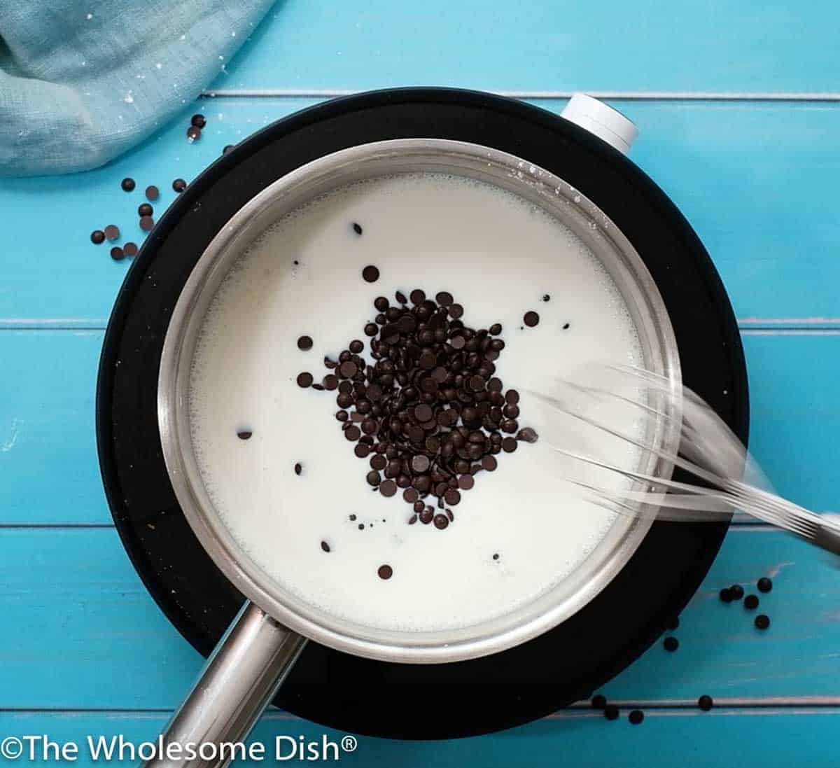 sauce pot with milk, sugar, and chocolate chips
