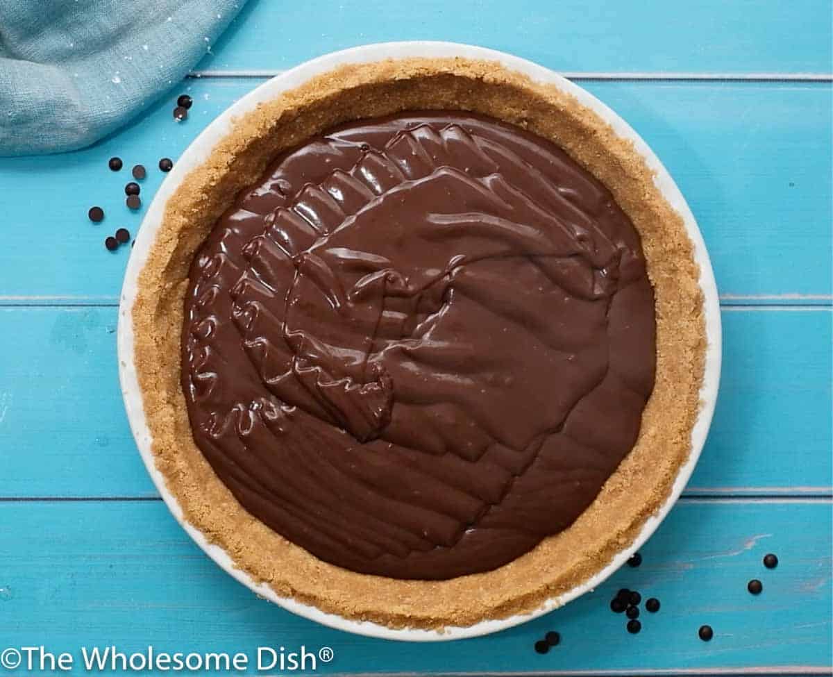 warm chocolate pudding drizzled in a graham cracker pie crust