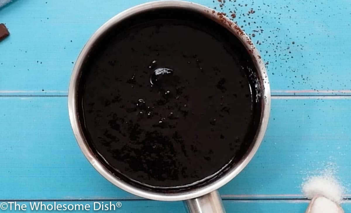 sauce pot with melted butter and chocolate for icing