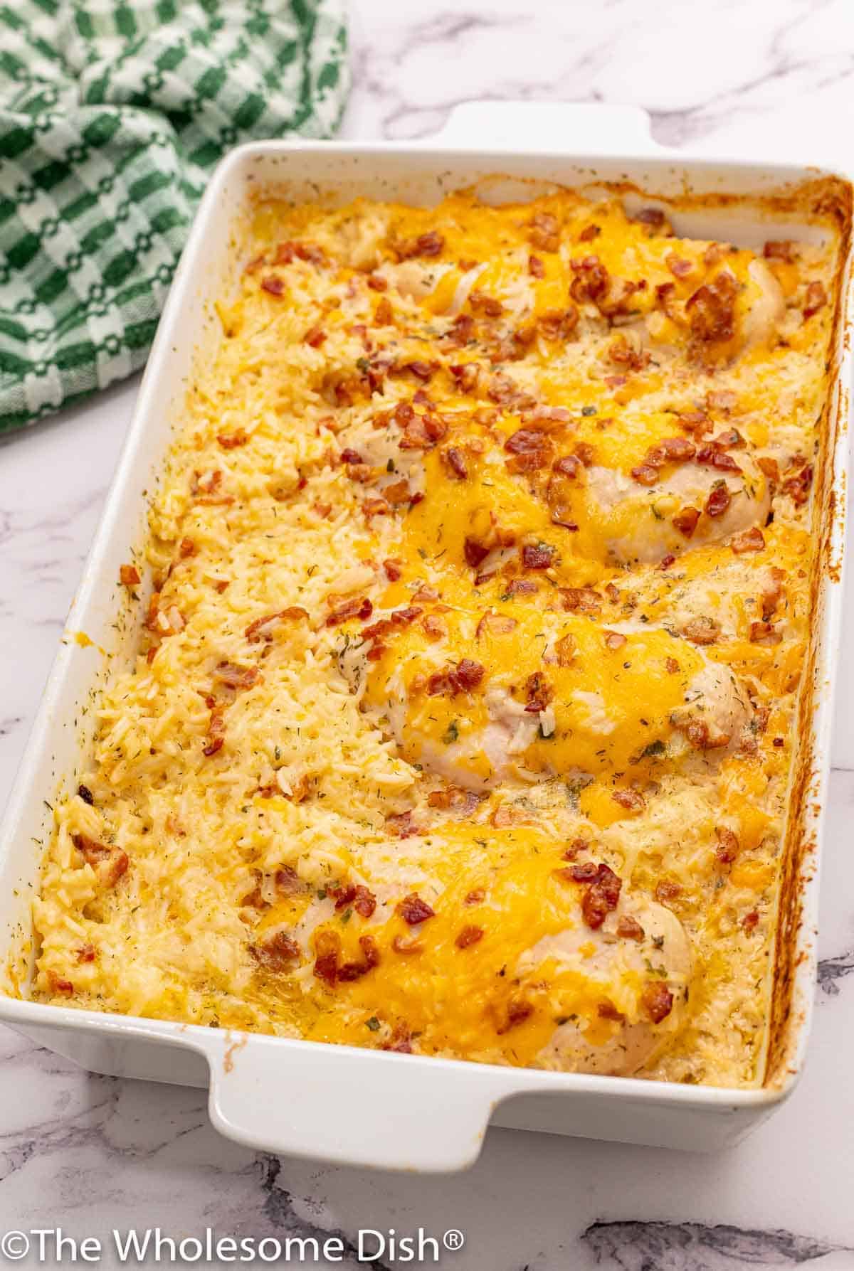 Baking dish full of chicken and rice casserole.