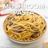 Bowl full of mushroom pasta with text overlay.