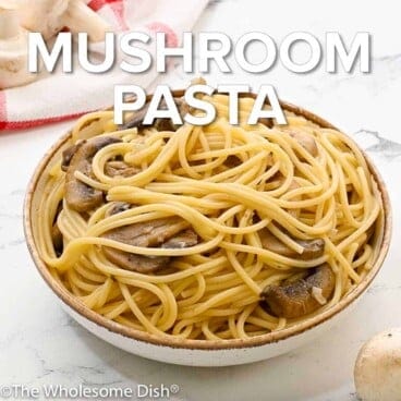 Bowl full of mushroom pasta with text overlay.