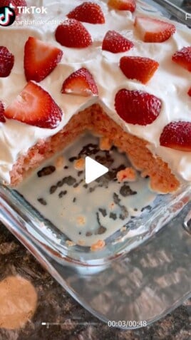 Baking dish full of strawberry tres leches cake.