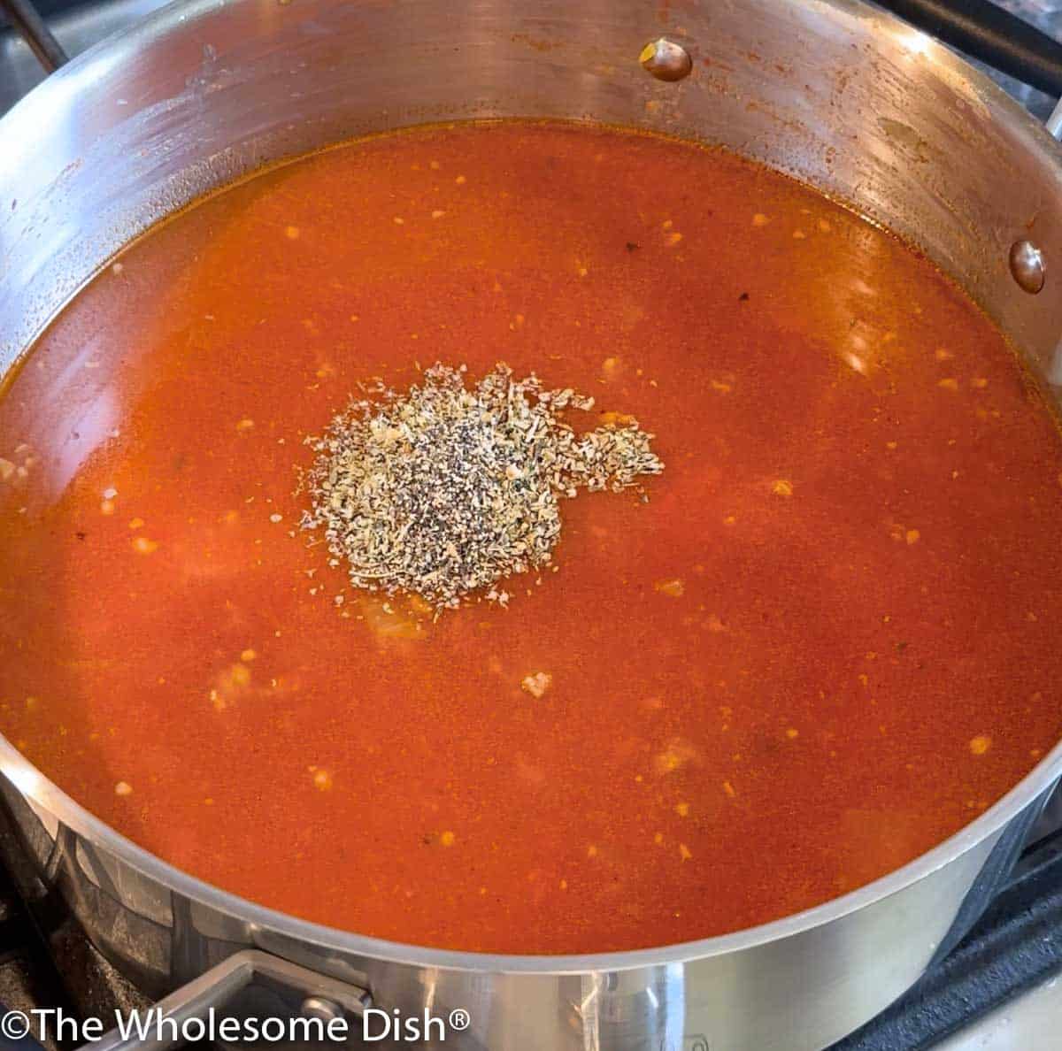 Seasonings being added to the pot.