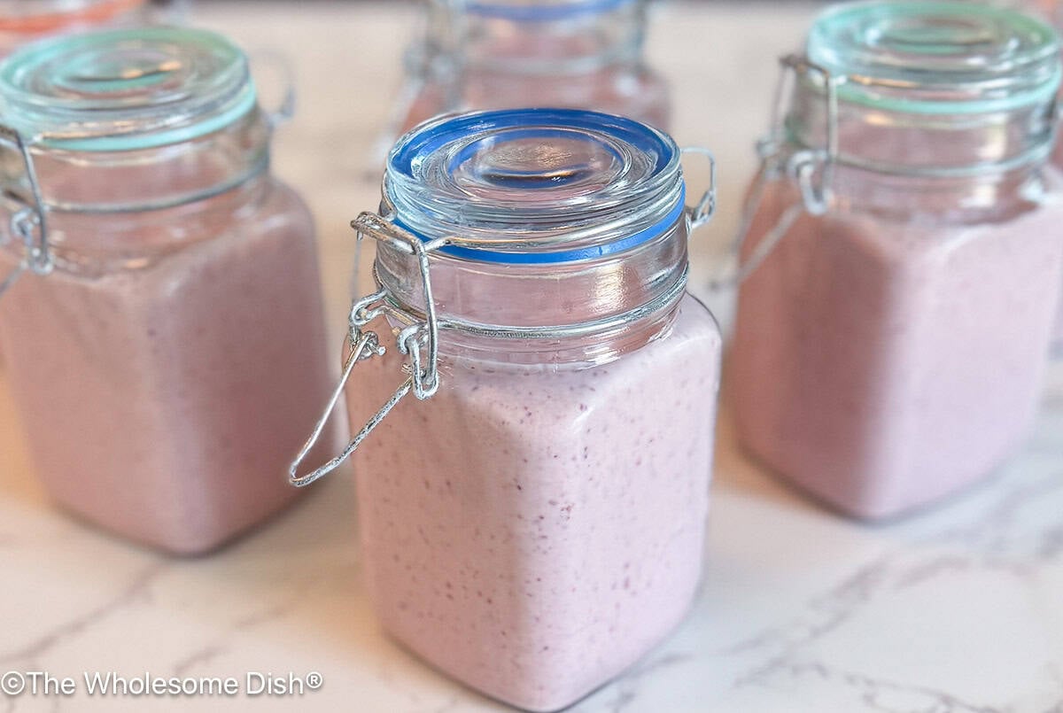Small glass bottles of drinkable yogurt smoothies.